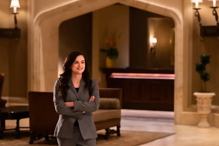 A team member smiling in the lobby of Montage Hotels & Resorts.