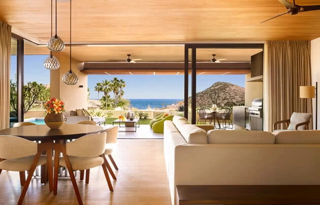 Montage Los Cabos residence, living and dining area with open wall showcasing water views