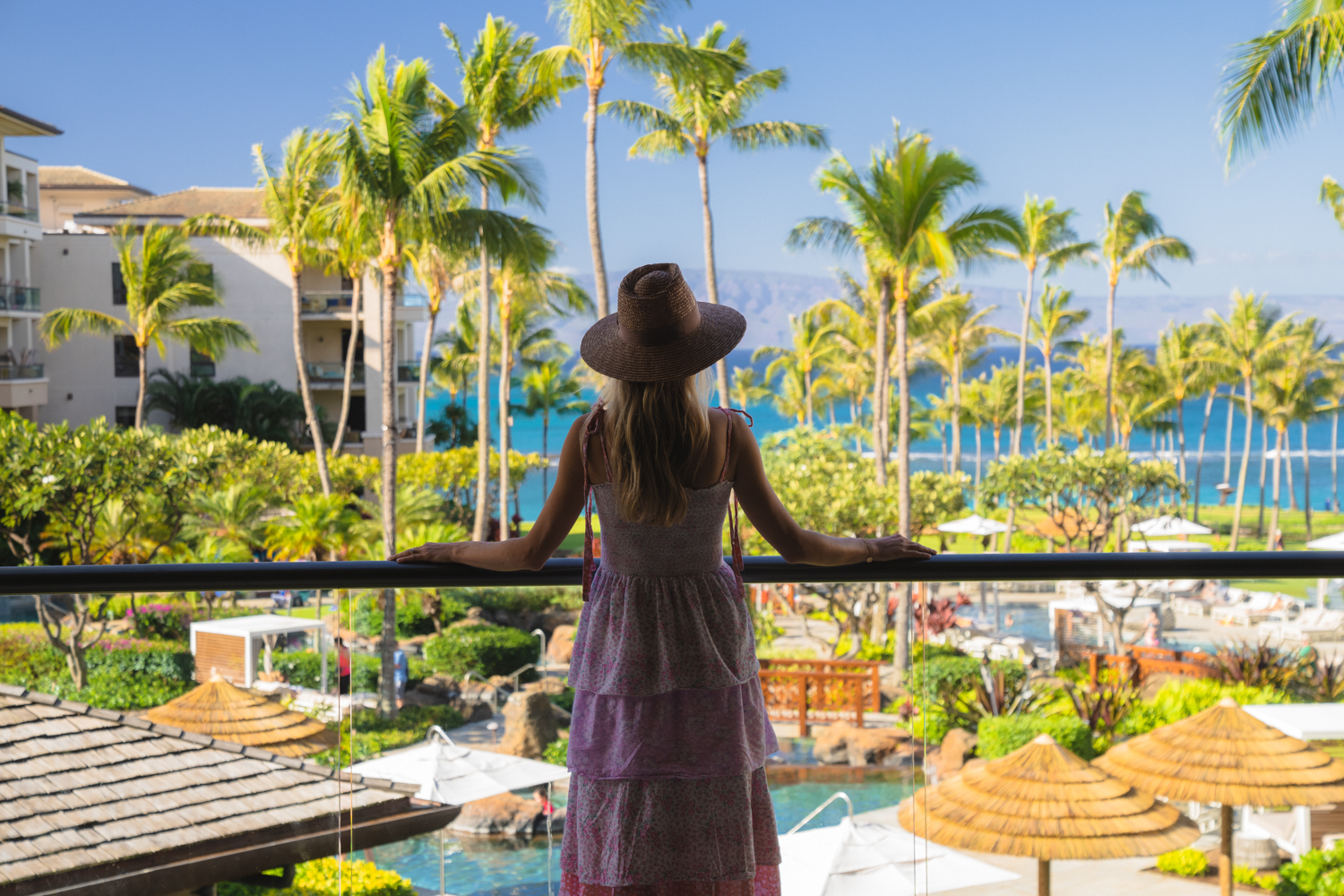 Woman overlooking resort at Montage Kapalua Bay
