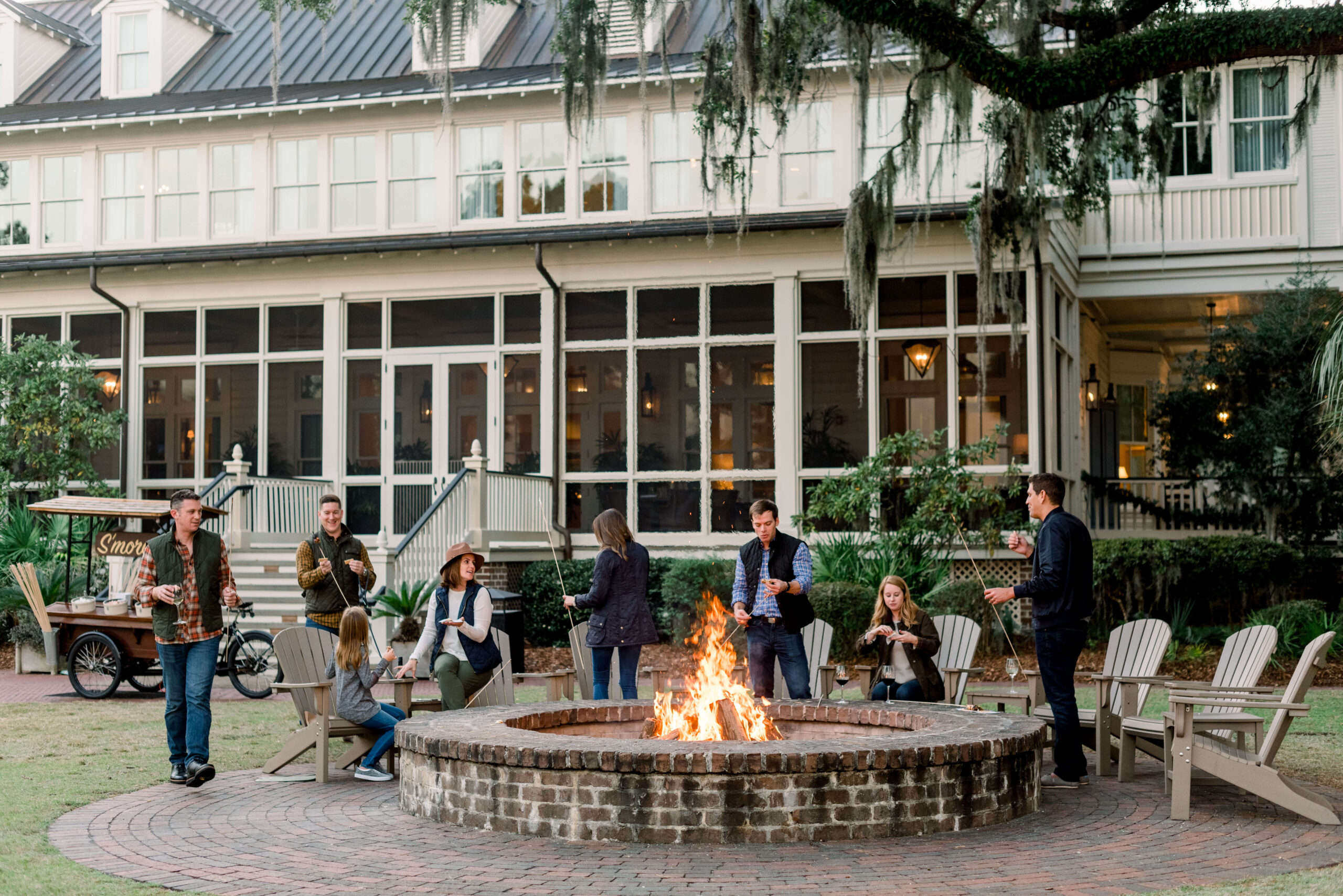 Montage Palmetto Bluff firepit, whith family gathering around