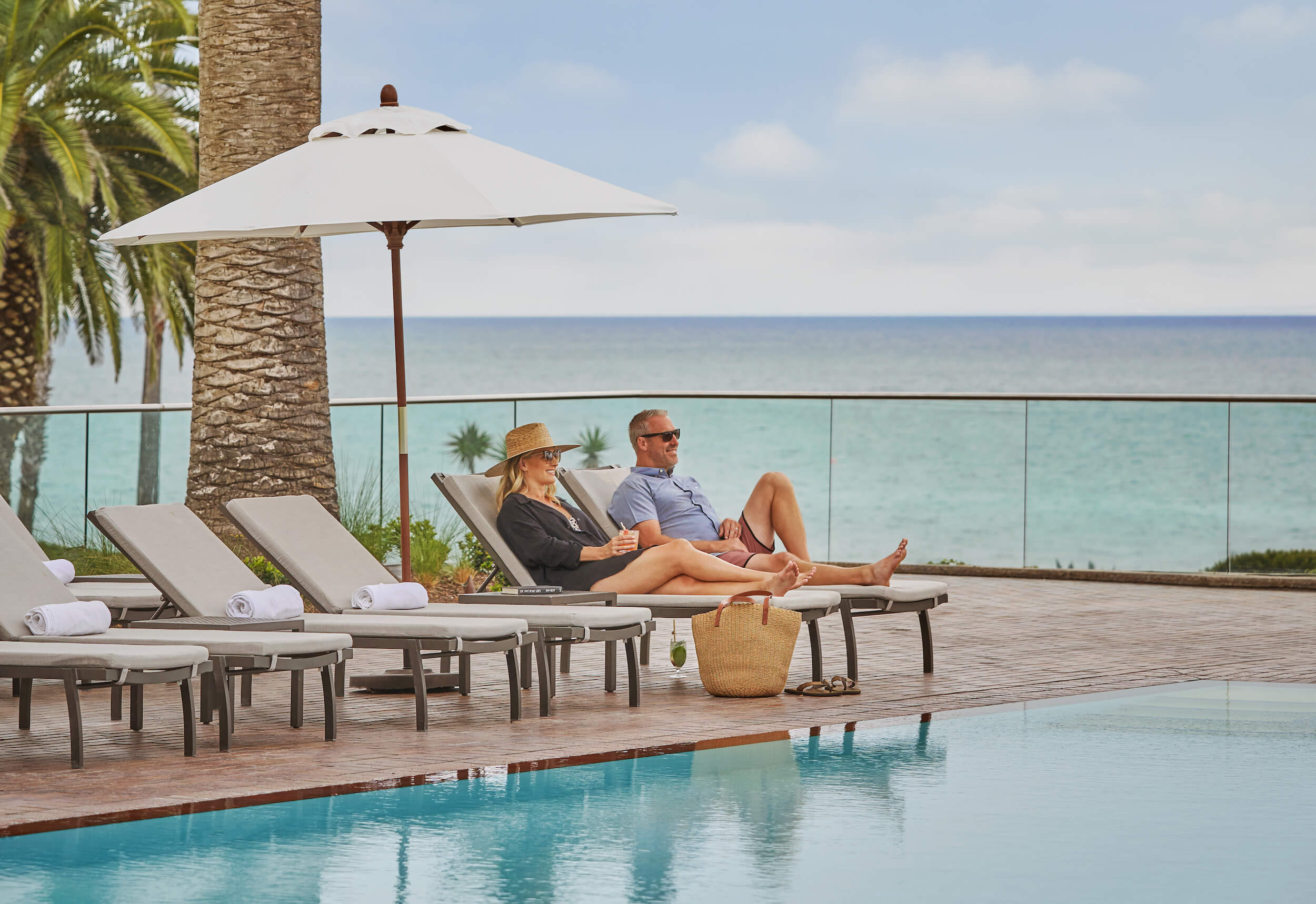 Couple lounging by pool at Montage Laguna Beach resort