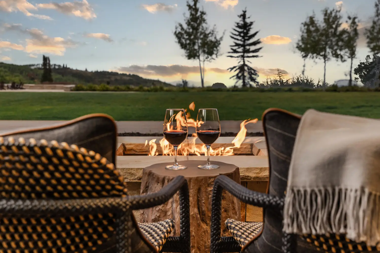 Two glasses of wine by a fire pit at Montage Deer Valley