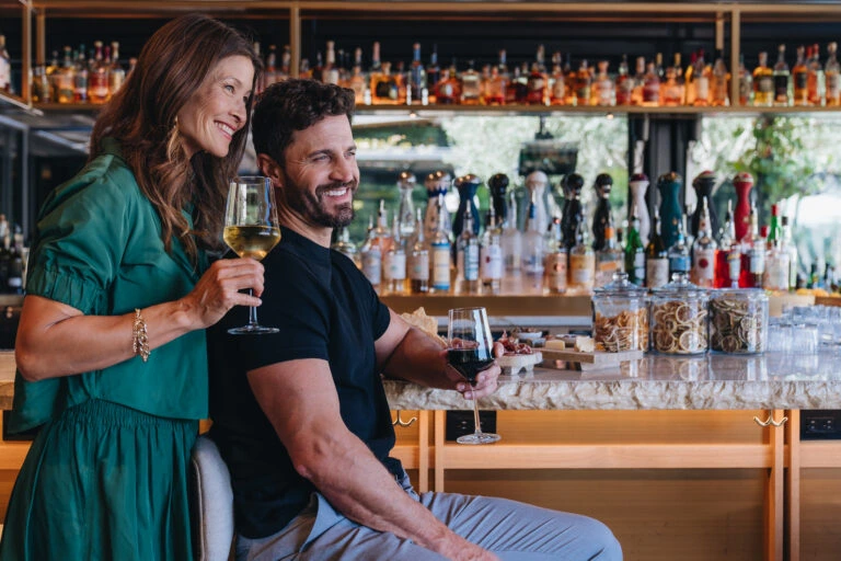 Couple enjoying wine at Scout Field Bar at Montage Healdsburg.