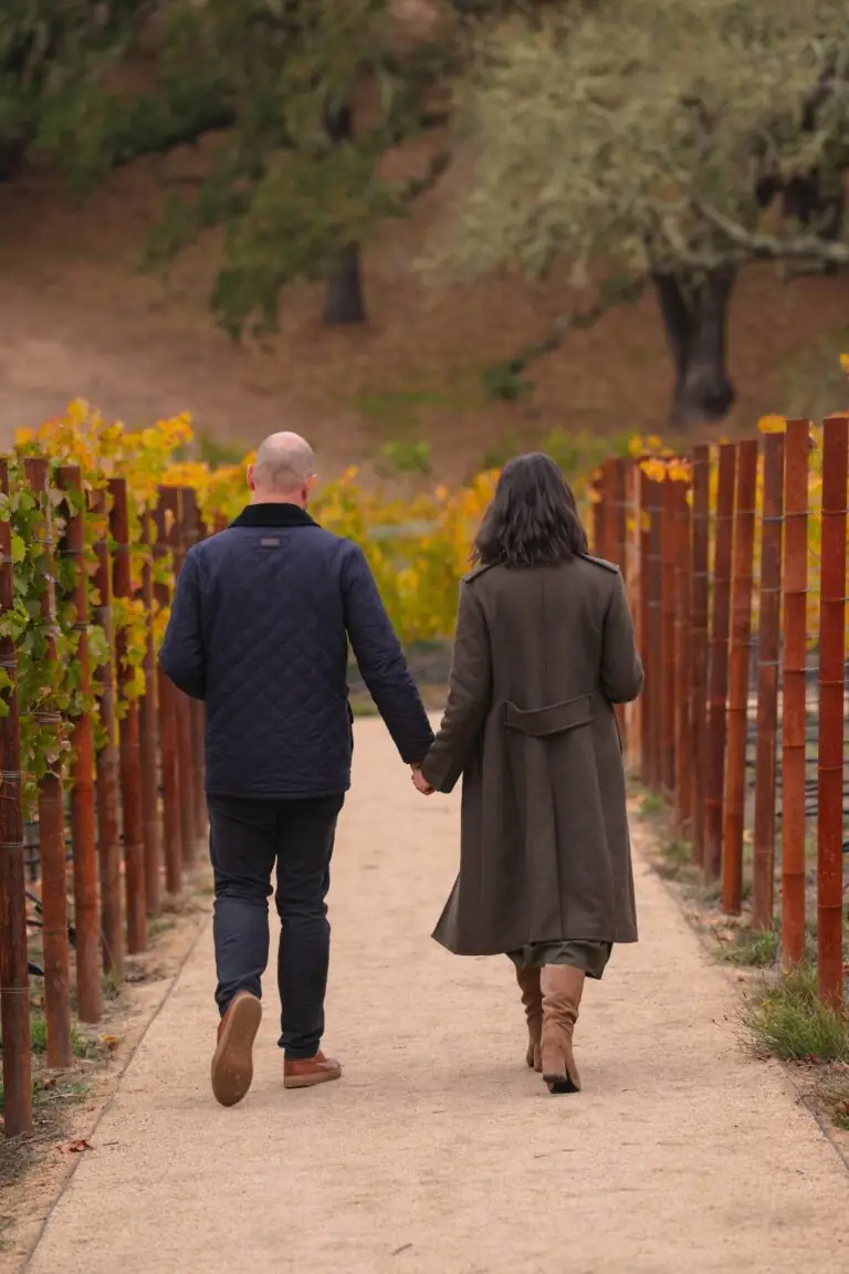 Couple walking in vineyard in Healdsburg