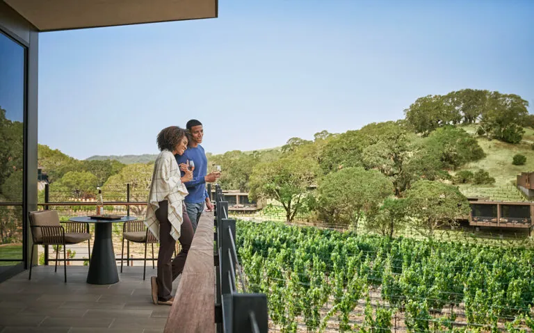A couple on their suite balcony.