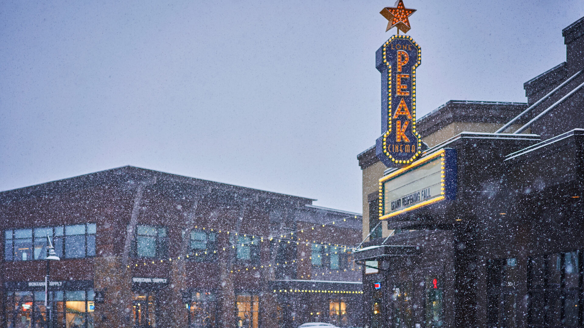 Outside Peak Cinema snowing