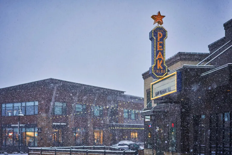 Outside Peak Cinema snowing