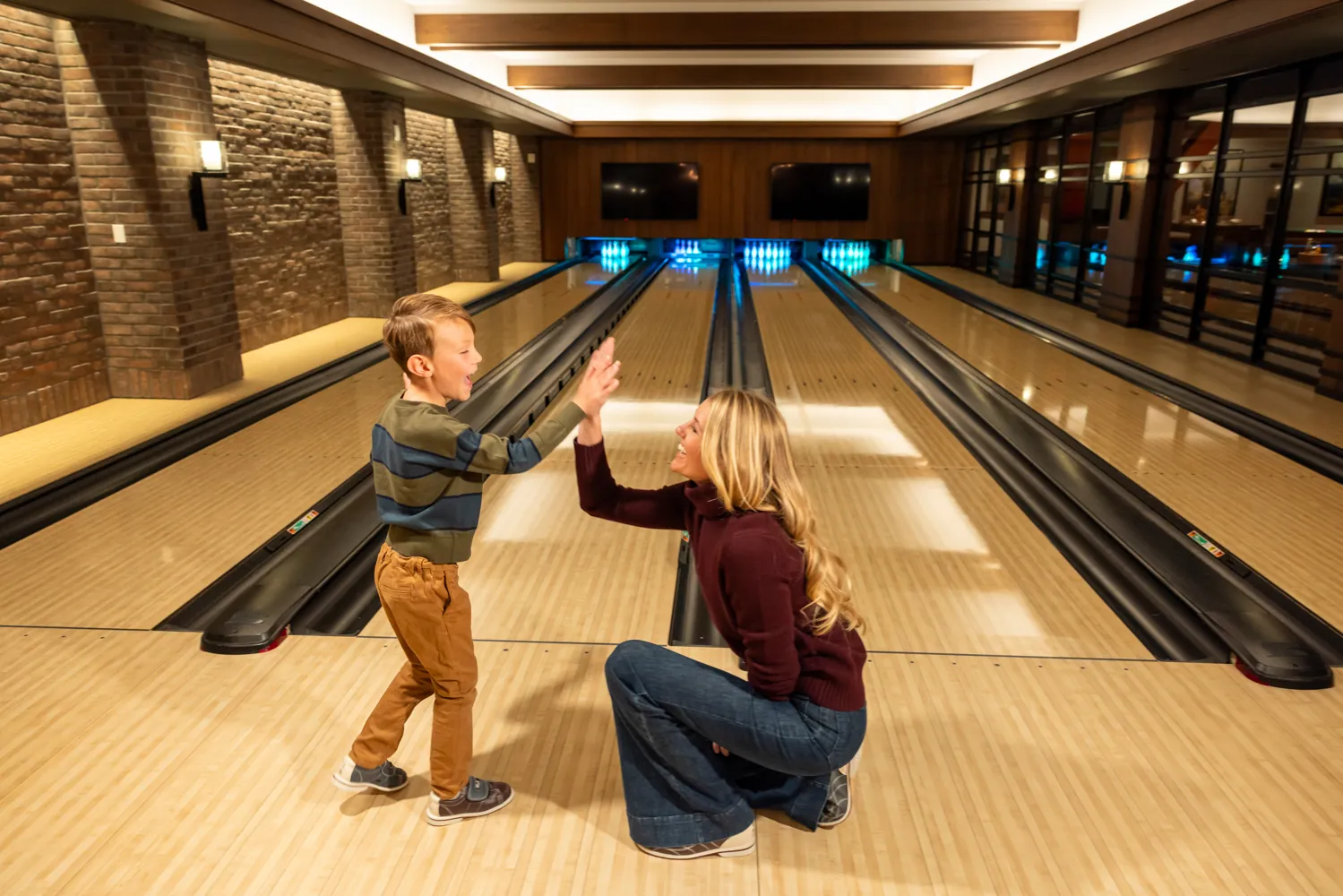 Mother and son bowling at Montage Big Sky