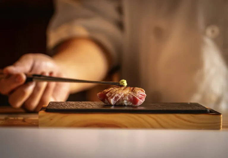 Taikun Sushi Chef adding the finishing touches to his work.