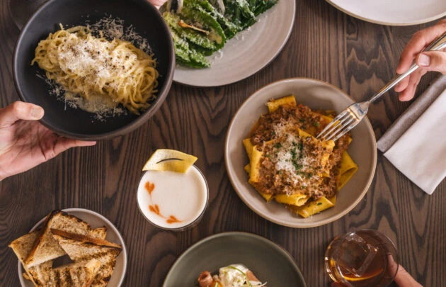 Pasta dishes served on a table at Cortina