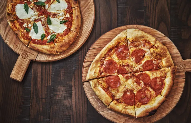 Two pizzas on a table at Beartooth Pub and Rec