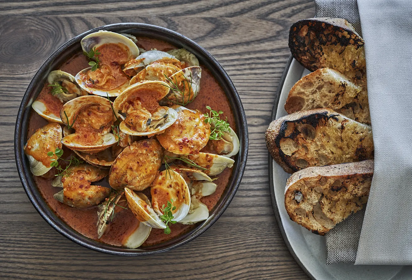 Bowl of clams with a side of toast at Cortina