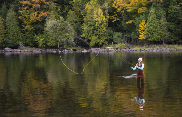 Girl Fishing in a River