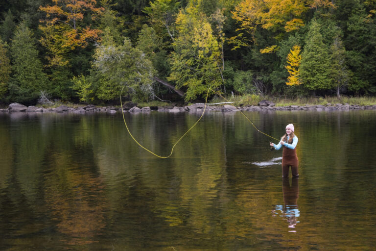 Girl Fishing in a River