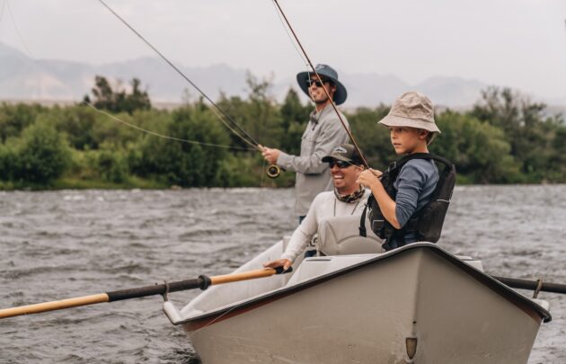 Three people fly fishing