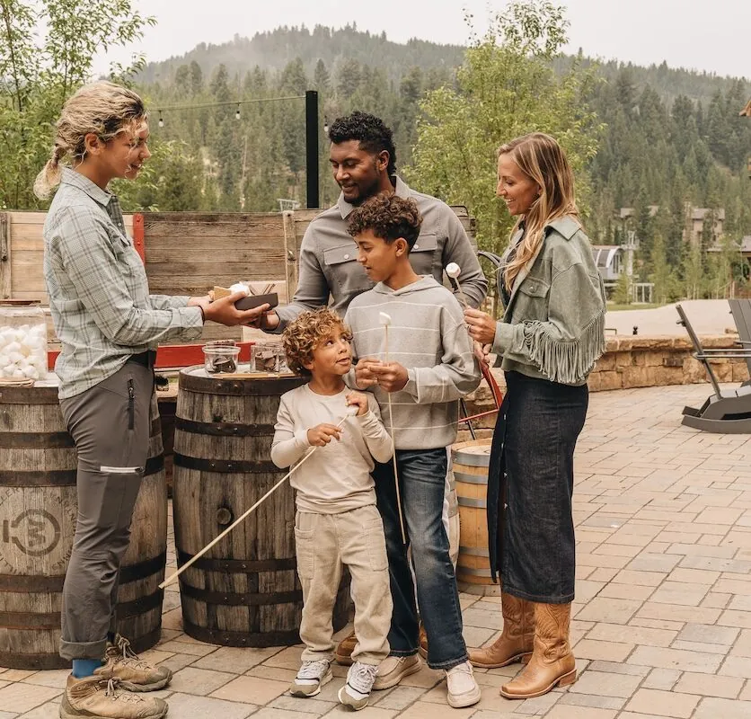 A family enjoying s'mores at Montage Big Sky.