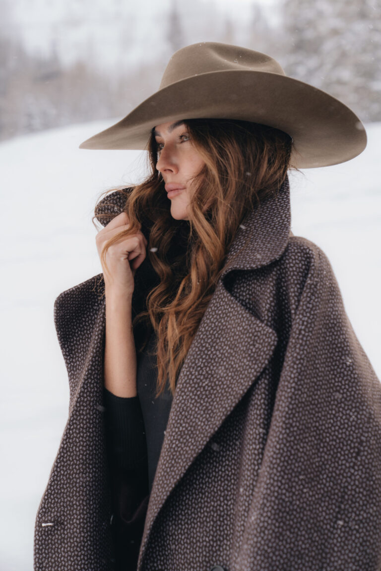 Woman in a cowboy hat and jacket