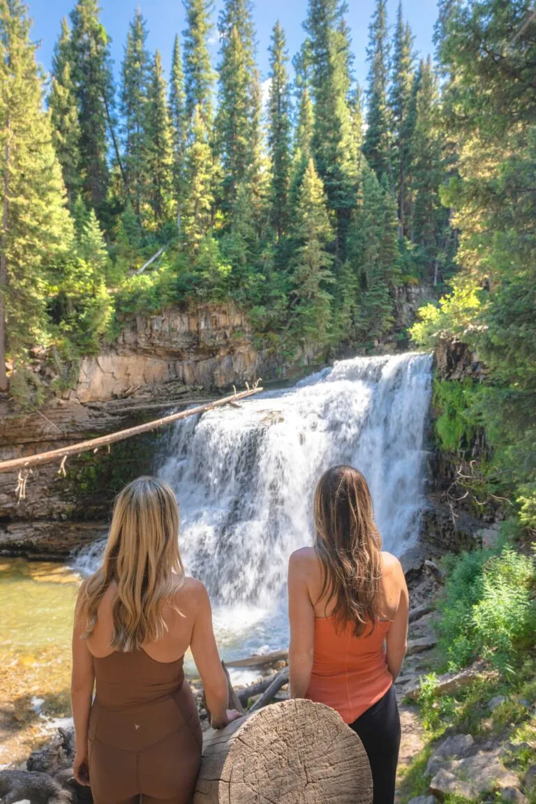 Two women looking at a waterfall