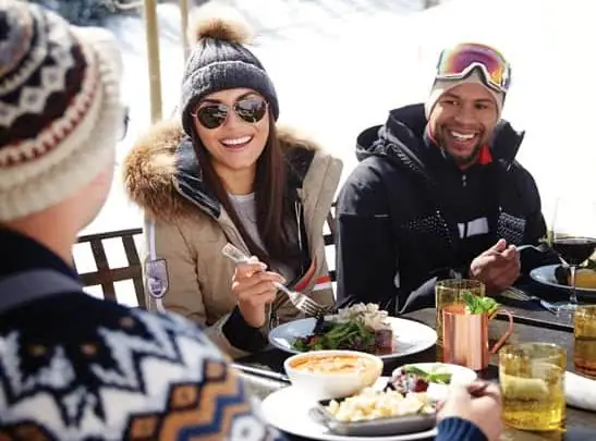 friends dining outside winter