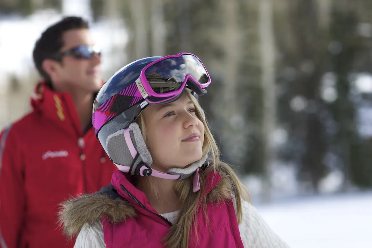 Young girl 7-9 outside, father in background