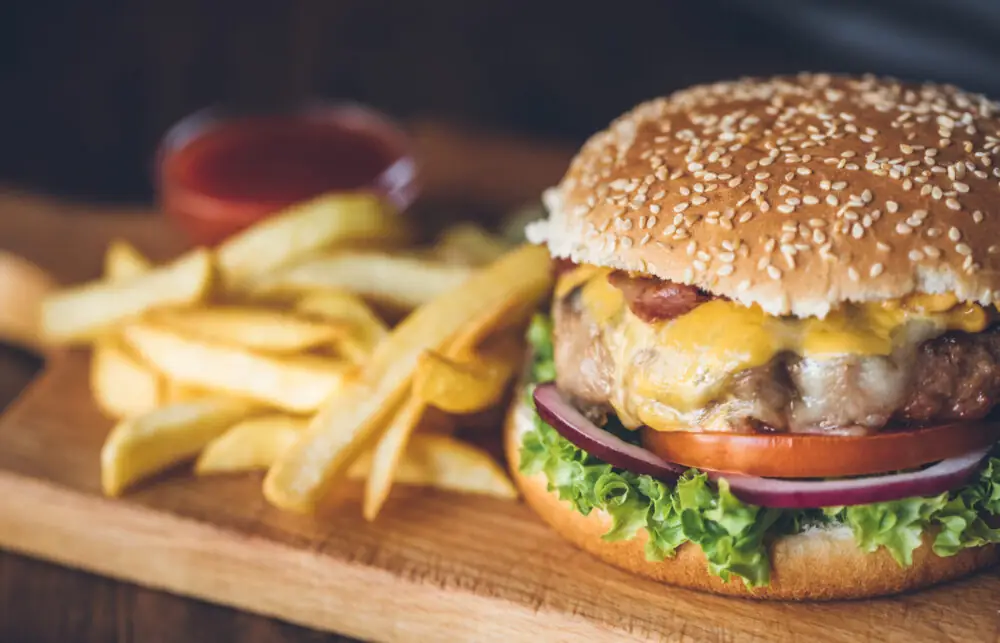 Hamburger with fries on a platter