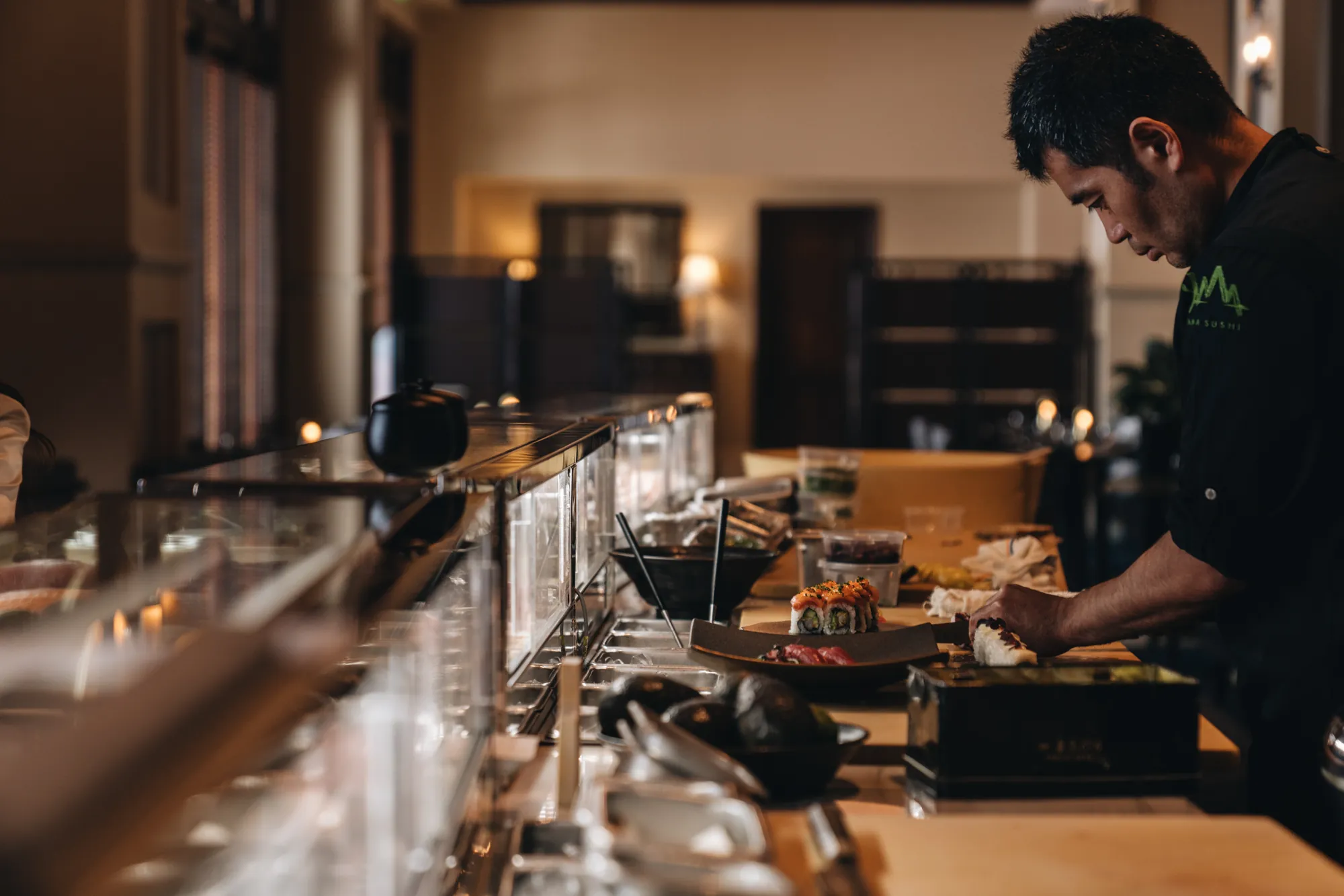 Chef rolling sushi at Yama Sushi