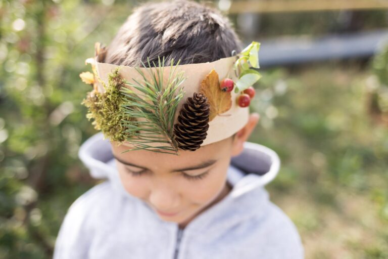 A child wearing a crown made by hand