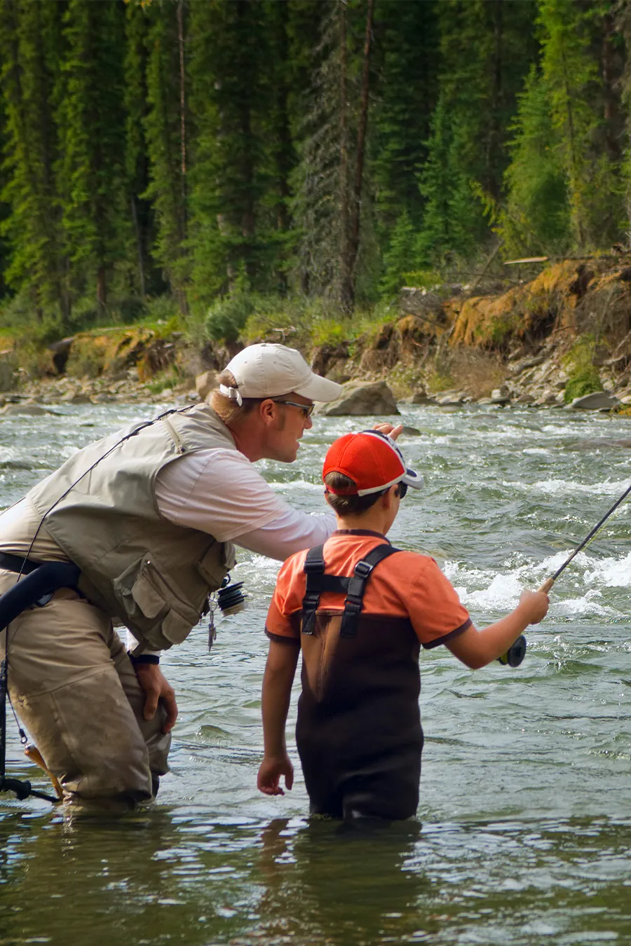 A father teaching his son how to fish