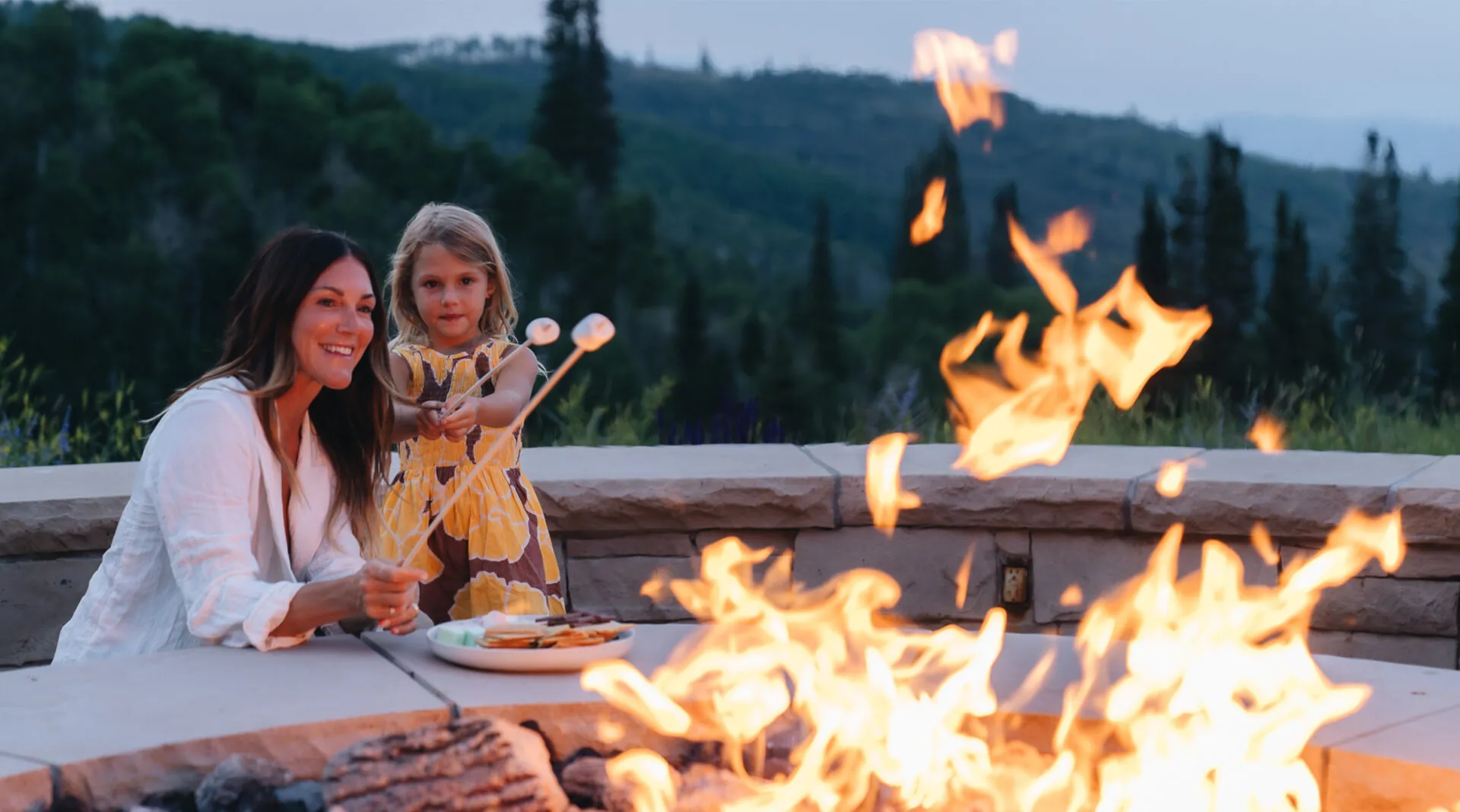 Mother and Daughter roasting marshmallows at Montage Deer Valley