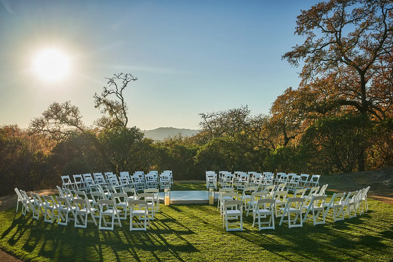 white chairs in circle on lawn