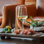 Bar food with a glass of white wine at Montage Healdsburg