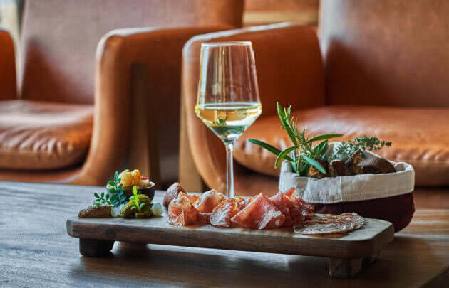 Bar food with a glass of white wine at Montage Healdsburg