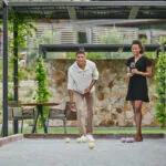 Couple playing bocce ball at luxury healdsburg hotel