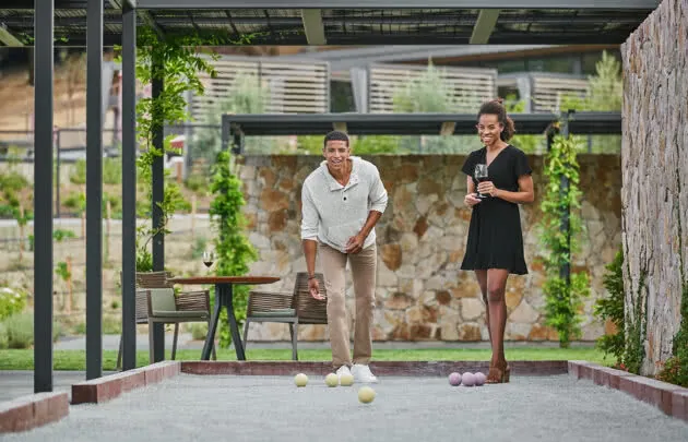 Couple playing bocce ball at luxury healdsburg hotel