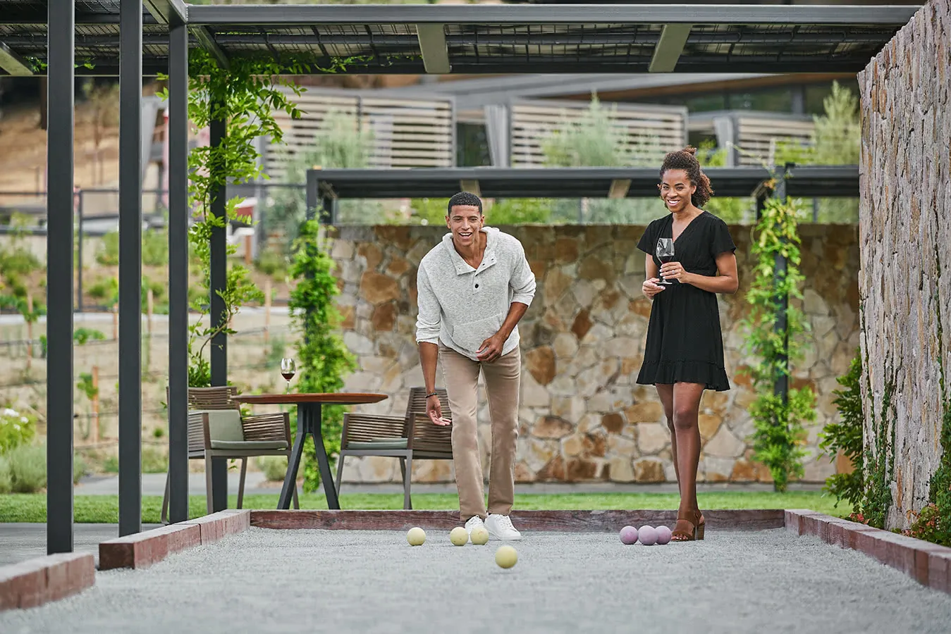 Couple playing bocce ball at luxury healdsburg hotel