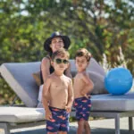 Family playing in the pool at Napa valley resort, Montage Healdsburg