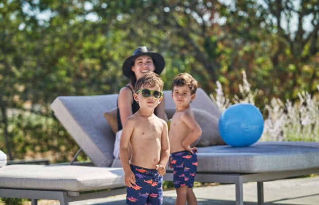 Family playing in the pool at Napa valley resort, Montage Healdsburg