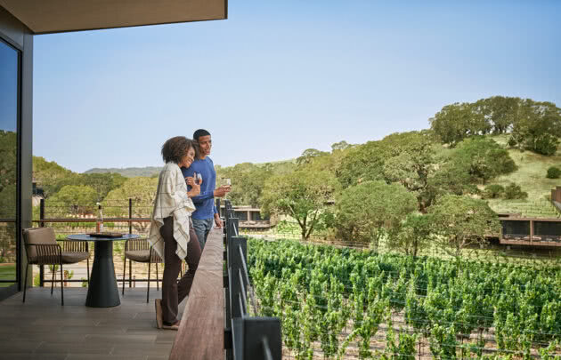 Couple looking out at napa valley vineyards at Montage Healdsburg resort