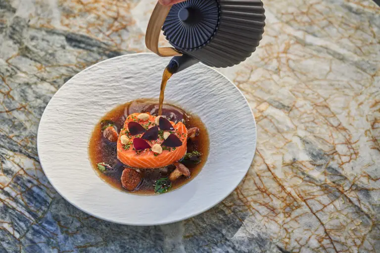 A sauce being over a dish at Hazel Hill at Montage Healdsburg