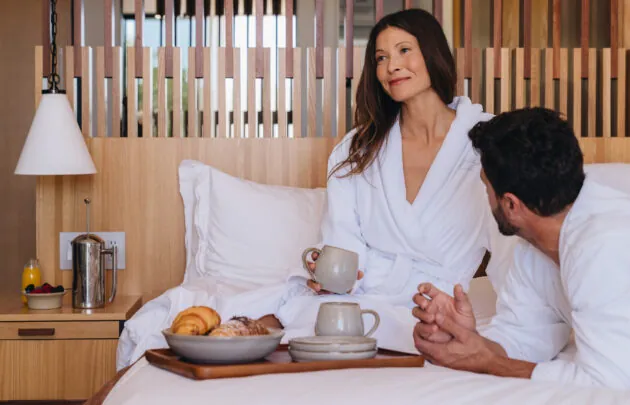 Couple enjoying in room dining
