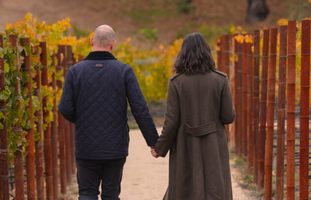 Couple walking in vineyard