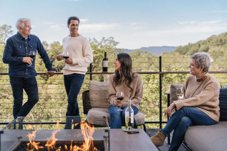 Couples enjoying wine on balcony at Montage Healdsburg.