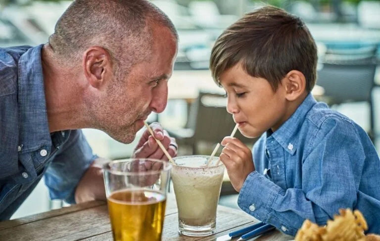 Father and son drinking a milkshake at Hudson Springs.