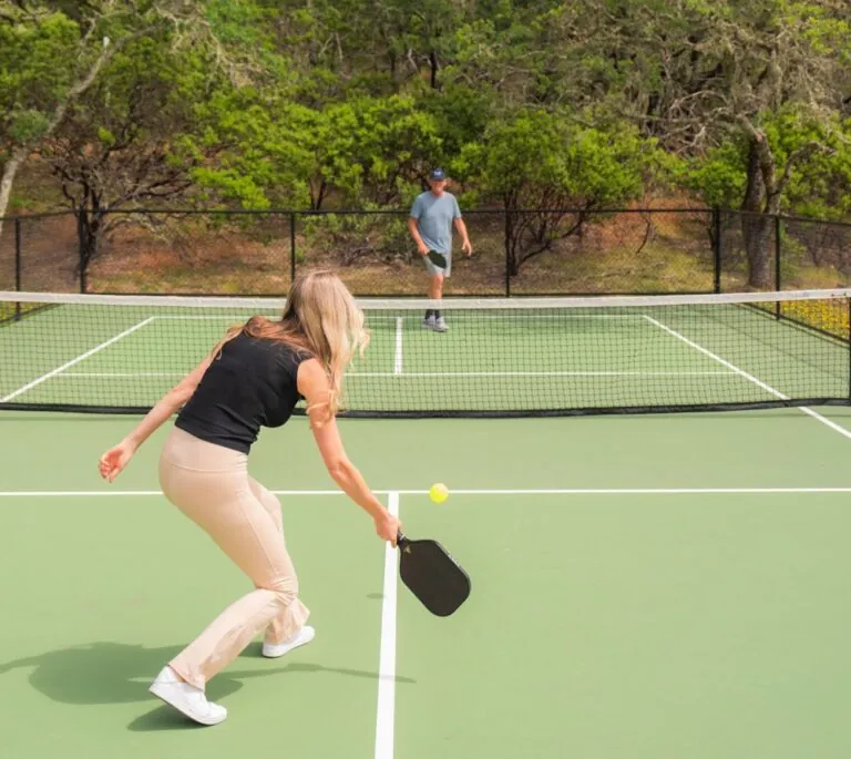 Couple playing pickleball.
