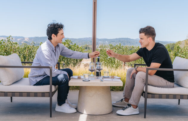 Two men enjoying wine tasting at Aperture Cellars.