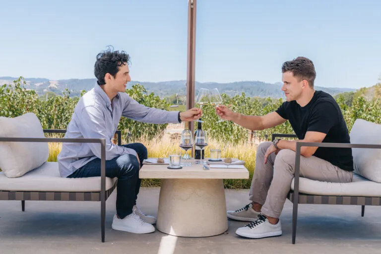 Two men enjoying wine tasting at Aperture Cellars.