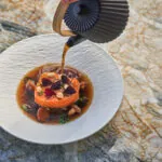Salmon dish on plate on table