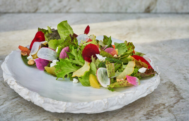 Salad on plate, on table