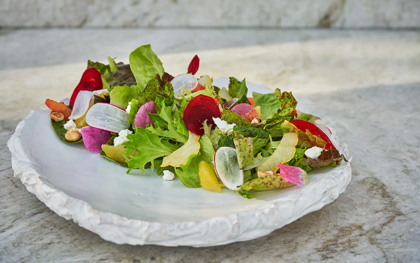 Salad on plate, on table