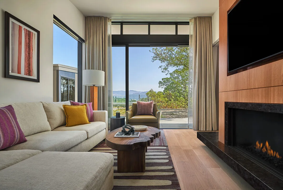 Couch in front of a fireplace at the Guest House